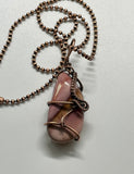 Heavy Gauge Copper that has been hammered and formed around this tumbled Mookaite Jasper. This Necklace is reversible and can be worn with either side facing out