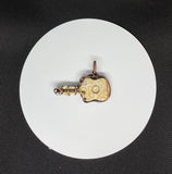 Fossilized Coral Guitar Pendant in Copper.