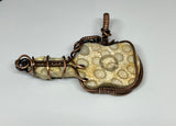 Fossilized Coral Guitar Pendant in Copper.