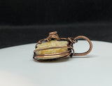 Fossilized Coral Guitar Pendant in Copper.