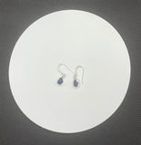 These elegant earrings showcase beautiful Blue Kyanite stones set in Sterling Silver. The deep, vibrant blue of the Kyanite contrasts beautifully with the sleek, polished silver, creating a sophisticated and timeless look. The earrings offer a touch of refined elegance and are perfect for adding a pop of color to any ensemble.