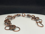 This Copper Flower Bud Bracelet is ideal for individuals who appreciate handcrafted jewelry with a touch of nature-inspired design. It appeals to those who love elegant, feminine accessories and value artisanal craftsmanship. This bracelet is perfect for those looking for a unique piece that can be worn daily or on special occasions.