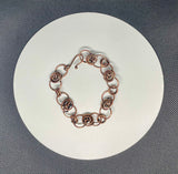 This Copper Flower Bud Bracelet is ideal for individuals who appreciate handcrafted jewelry with a touch of nature-inspired design. It appeals to those who love elegant, feminine accessories and value artisanal craftsmanship. This bracelet is perfect for those looking for a unique piece that can be worn daily or on special occasions.