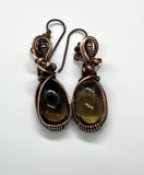 Copper embraces smoky quartz in these earrings, the stones glinting like twilight through mist. Niobium ear wires complete the design with a gentle, skin-friendly touch.