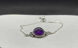 Elevate your accessory collection with the Adjustable Sterling Silver (.925) and Amethyst Bracelet. This elegant bracelet combines the timeless beauty of sterling silver with the enchanting allure of amethyst, offering a piece that is both versatile and sophisticated.