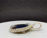 Blue Striped Agate Pendant in wire wrapped Sterling Silver