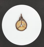 This stunning Crazy Lace Agate pendant showcases intricate copper wire wrapping. The agate's vibrant patterns are beautifully highlighted by the handwoven copper, creating a distinctive and eye-catching piece. The detailed craftsmanship enhances the natural beauty of the stone, making it a unique addition to any jewelry collection.