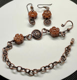 This enchanting set includes beautifully crafted earrings featuring Goldstone flowers paired with durable niobium ear wires for added comfort and style. The earrings are complemented by an adjustable bracelet, also adorned with Goldstone flowers and copper accents, ensuring a perfect fit for any wrist size. The warm, shimmering tones of Goldstone combined with the rustic charm of copper create a harmonious and eye-catching design.