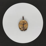 Embrace the natural beauty of the earth with the Picture Jasper Tree of Life Pendant in Copper. This stunning piece features a richly detailed picture jasper cabochon, intricately set within a handcrafted copper Tree of Life design. The pendant combines natural artistry with elegant craftsmanship, creating a timeless accessory.