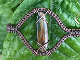 This bracelet showcases the natural beauty of blue and brown kyanite, elegantly wrapped in warm copper wire. The combination of earthy browns and deep blues creates a harmonious, grounding energy, while the handcrafted copper wrapping adds an artisan touch.