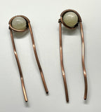 These Heavy Gauge Wire Wrapped Copper Hair Clips/Forks/Barrettes with White Moonstone are elegant and functional accessories that combine the durability of heavy gauge copper with the ethereal beauty of white moonstones. The artisanal craftsmanship and unique design make these pieces a standout choice for those who appreciate stylish and well-made hair accessories.