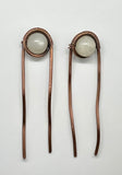 These Heavy Gauge Wire Wrapped Copper Hair Clips/Forks/Barrettes with White Moonstone are elegant and functional accessories that combine the durability of heavy gauge copper with the ethereal beauty of white moonstones. The artisanal craftsmanship and unique design make these pieces a standout choice for those who appreciate stylish and well-made hair accessories.