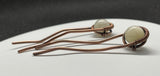 These Heavy Gauge Wire Wrapped Copper Hair Clips/Forks/Barrettes with White Moonstone are elegant and functional accessories that combine the durability of heavy gauge copper with the ethereal beauty of white moonstones. The artisanal craftsmanship and unique design make these pieces a standout choice for those who appreciate stylish and well-made hair accessories.