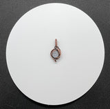This Rainbow Moonstone Mini Pendant in Copper is a beautifully crafted accessory that highlights the ethereal beauty of Rainbow Moonstone within a delicately designed copper setting. Its miniature size and elegant design make it a versatile and enchanting piece, perfect for adding a touch of magic to any outfit.