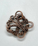 Welcome in the warmth of spring and summer with this whimsical butterfly pendant, lovingly crafted in wire-wrapped copper. Delicate curves and graceful lines bring this symbol of transformation and renewal to life, making it a beautiful reminder of nature’s cycles. Lightweight and full of charm, it's the perfect piece to celebrate the season or gift to someone embracing new beginnings.