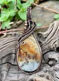 This Colorful Lace Agate Pendant in Wire Wrapped Copper is ideal for individuals who appreciate the beauty of natural gemstones and the artistry of handcrafted jewelry. It appeals to those who love unique, statement pieces with vibrant colors and intricate designs. This pendant is perfect for fashion-forward individuals who value both style and the natural charm of gemstones.