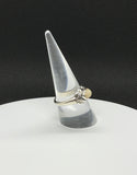 This enchanting ring features a radiant Welo Opal, showcasing its captivating flashes of color, set in sterling silver with an intricate leaf design. The delicate silver leaves wrap around the opal, adding a touch of nature-inspired elegance to the piece. Perfect for nature lovers and opal enthusiasts, this size 8 ring combines the timeless beauty of sterling silver with the organic charm of the leaf motif for a truly unique and refined accessory.