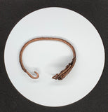 This bracelet is crafted from heavy gauge copper, giving it a solid and robust feel. The thick copper wire provides the structure of the bracelet, ensuring durability and longevity. Copper is known for its rich, warm tones, which develop a unique patina over time, adding to the bracelet’s character. The heavy gauge wire ensures that the bracelet maintains its shape and withstands everyday wear while offering a substantial, bold look.