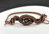 Handwoven Copper Weaves surround a beautiful Peacock Pearl in this handmade bracelet.