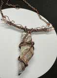 Make a bold statement with this Crazy Lace Agate Necklace, featuring a stunning piece of crazy lace agate set in intricate wire-wrapped copper. The unique patterns and vibrant colors of the agate are beautifully highlighted by the handcrafted copper setting, creating a striking and elegant necklace.
