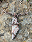 Make a bold statement with this Crazy Lace Agate Necklace, featuring a stunning piece of crazy lace agate set in intricate wire-wrapped copper. The unique patterns and vibrant colors of the agate are beautifully highlighted by the handcrafted copper setting, creating a striking and elegant necklace.