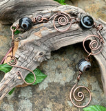 This bracelet features hand-formed and hammered copper links, each uniquely crafted for a rustic yet refined appeal. Adorned with beautiful Botswana agate beads, known for their soothing gray and earthy tones, this bracelet combines elegance with natural charm. Perfect for everyday wear or as a statement accessory.