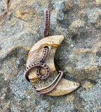 This captivating pendant features a beautiful Picture Jasper stone in a crescent moon shape, wrapped in warm, handwoven copper wire. The natural earthy tones and intricate patterns of the Picture Jasper evoke a sense of grounding and connection to nature, while the copper wire adds a rustic elegance. Perfect for those who appreciate celestial designs and the beauty of handcrafted jewelry, this pendant makes a stunning and meaningful accessory.
