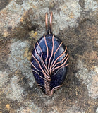 This Blue Goldstone Copper Tree of Life Pendant is a stunning representation of nature and the cosmos, featuring a mesmerizing Blue Goldstone cabochon that shimmers like a dark, starry night sky. Handcrafted in copper, the pendant showcases a Tree of Life design, symbolizing growth, strength, and connection. This pendant is perfect for those who love celestial-inspired jewelry with a touch of natural elegance.