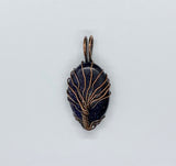 This Blue Goldstone Copper Tree of Life Pendant is a stunning representation of nature and the cosmos, featuring a mesmerizing Blue Goldstone cabochon that shimmers like a dark, starry night sky. Handcrafted in copper, the pendant showcases a Tree of Life design, symbolizing growth, strength, and connection. This pendant is perfect for those who love celestial-inspired jewelry with a touch of natural elegance.