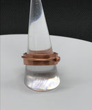 This minimalist yet bold ring is crafted entirely from solid copper, featuring a sleek copper band accent for added texture and visual interest. The rich, warm tones of the copper create a timeless, rustic charm, making it perfect for those who appreciate simple, elegant designs with a handcrafted feel. A versatile piece, this ring adds a touch of earthy sophistication to any look.