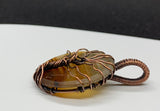 This Lightweight Striped Agate Tree of Life Pendant is a striking and elegant piece of jewelry that combines the natural beauty of striped agate with the timeless symbolism of the Tree of Life. Crafted in copper, this pendant offers a blend of modern and classic styles, making it a versatile addition to any jewelry collection.