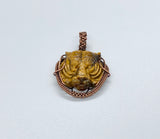 Carved Tiger Eye Tiger Pendant wrapped in Copper