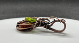 Embrace the spirit of fall with this charming swirling Goldstone pumpkin pendant, beautifully wrapped in warm copper. The rich, shimmering tones of the Goldstone capture the essence of autumn, while a delicate glass leaf accent adds a playful touch. This unique pendant is perfect for celebrating the season, making it an ideal accessory for fall festivities or a thoughtful gift for nature lovers. Add a touch of seasonal elegance to your collection with this delightful piece!