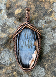 Mystery Blue Stone Pendant in handwoven Copper.
