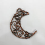 This Copper Moon Pendant is an enchanting piece accented with delicate Freshwater Pearls and Moonstones. The combination of these elements creates a celestial and feminine aesthetic that evokes a sense of mystery and beauty. The warm tones of the copper contrast beautifully with the iridescence of the Moonstone and the soft sheen of the pearls, making this pendant a striking accessory for any occasion.