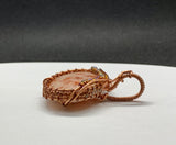Sparkling Sunstone Pendant in Wire Wrapped Copper with glass bead accents.