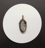 Mystery Blue Stone Pendant in handwoven Copper.
