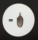 Mystery Blue Stone Pendant in handwoven Copper.