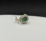 This stunning adjustable ring features a mesmerizing Green Goldstone, wire wrapped in Argentium Silver. The rich green tones of the Goldstone sparkle with flecks of silver, creating a captivating effect that catches the light beautifully. The ring's adjustable design ensures a perfect fit for various finger sizes, making it a versatile and elegant addition to any jewelry collection. The combination of the shimmering Green Goldstone and the sleek Argentium Silver creates an eye-catching piece.