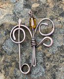 Hammered Copper Flower Design This exquisite shawl or scarf pin features a beautifully hammered copper flower design that adds a touch of artisanal charm to any outfit. The unique texture of the hammered copper catches the light, creating a warm, inviting glow. Versatile and stylish, this pin can be used to secure your favorite shawl or scarf, or worn as a statement brooch on jackets and bags. Elevate your accessory collection with this handcrafted piece that beautifully combines functionality with elegant