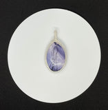 Beautiful Purple Tiffany Stone set in handwoven Sterling (.925) and Fine (.999) Silver.