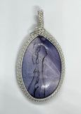 Beautiful Purple Tiffany Stone set in handwoven Sterling (.925) and Fine (.999) Silver.