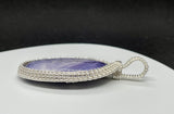 Beautiful Purple Tiffany Stone set in handwoven Sterling (.925) and Fine (.999) Silver.