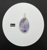 Beautiful Purple Tiffany Stone set in handwoven Sterling (.925) and Fine (.999) Silver.
