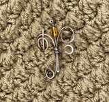This exquisite shawl or scarf pin features a beautifully hammered copper flower design that adds a touch of artisanal charm to any outfit. The unique texture of the hammered copper catches the light, creating a warm, inviting glow. Versatile and stylish, this pin can be used to secure your favorite shawl or scarf, or worn as a statement brooch on jackets and bags. Elevate your accessory collection with this handcrafted piece that beautifully combines functionality with elegant design.