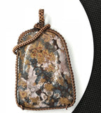 This Bold Flower Jasper Pendant in Copper features a striking and vibrant flower jasper stone set within a beautifully crafted copper frame. Known for its rich colors and intricate patterns, the flower jasper provides a dramatic focal point, while the copper setting enhances the pendant's natural beauty with a touch of artisanal elegance. This pendant is a statement piece that combines bold design with handcrafted quality.