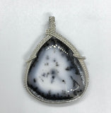 This stunning statement piece features a large Dendritic Opal Pendant wrapped in Sterling Silver.