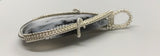 This stunning statement piece features a large Dendritic Opal Pendant wrapped in Sterling Silver.