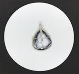 This stunning statement piece features a large Dendritic Opal Pendant wrapped in Sterling Silver.