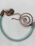 This vibrant turquoise-colored leather bracelet adds a pop of color to your accessory collection. Crafted with care, it features unique handmade hammered copper clasps that provide both durability and artistic flair. A charming flower dangle accentuates the design, adding a playful touch. This bracelet is not only stylish but also comfortable, making it a perfect choice for everyday wear or special occasions. Embrace the beauty of handcrafted jewelry with this delightful piece!